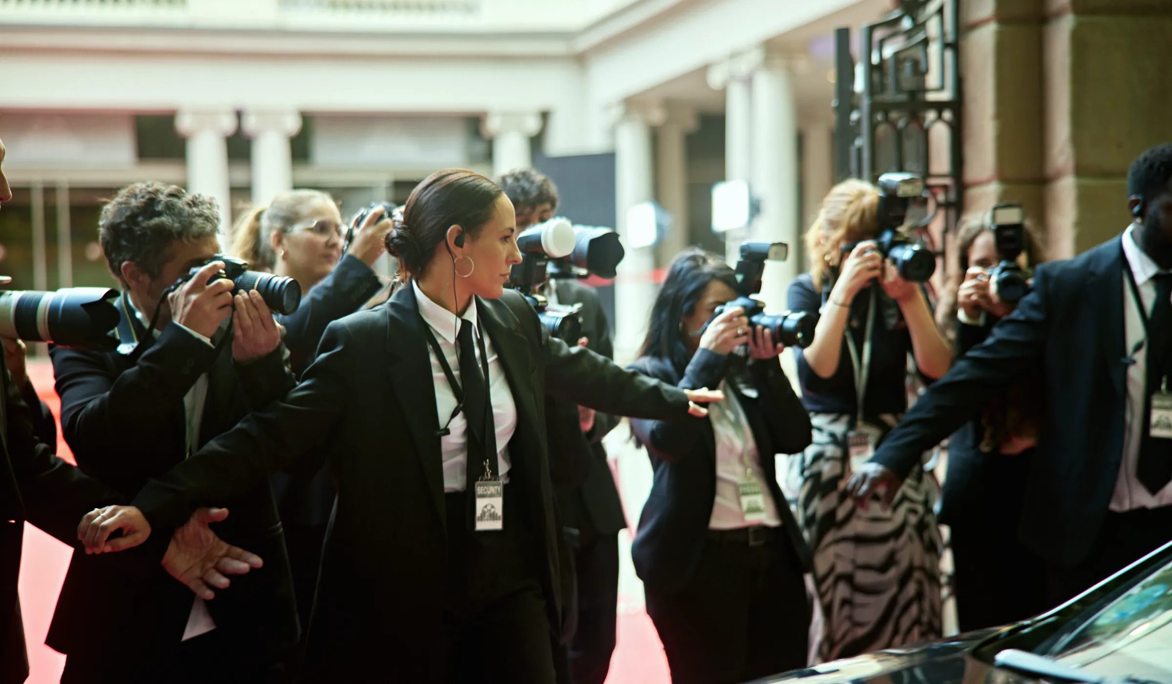 Close protection officer managing security at a public event