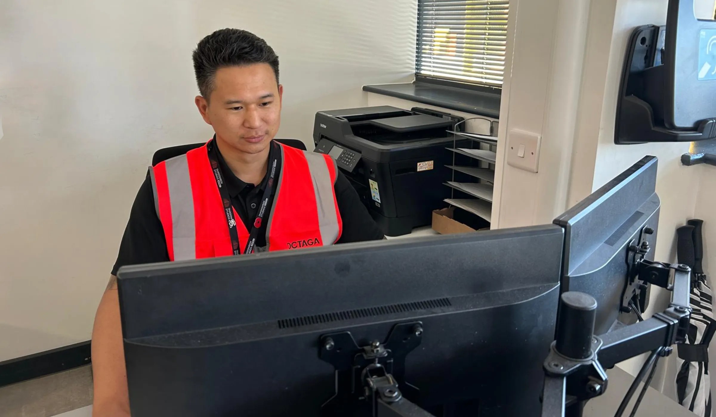 Octaga security officer monitoring screens on site at a film studio