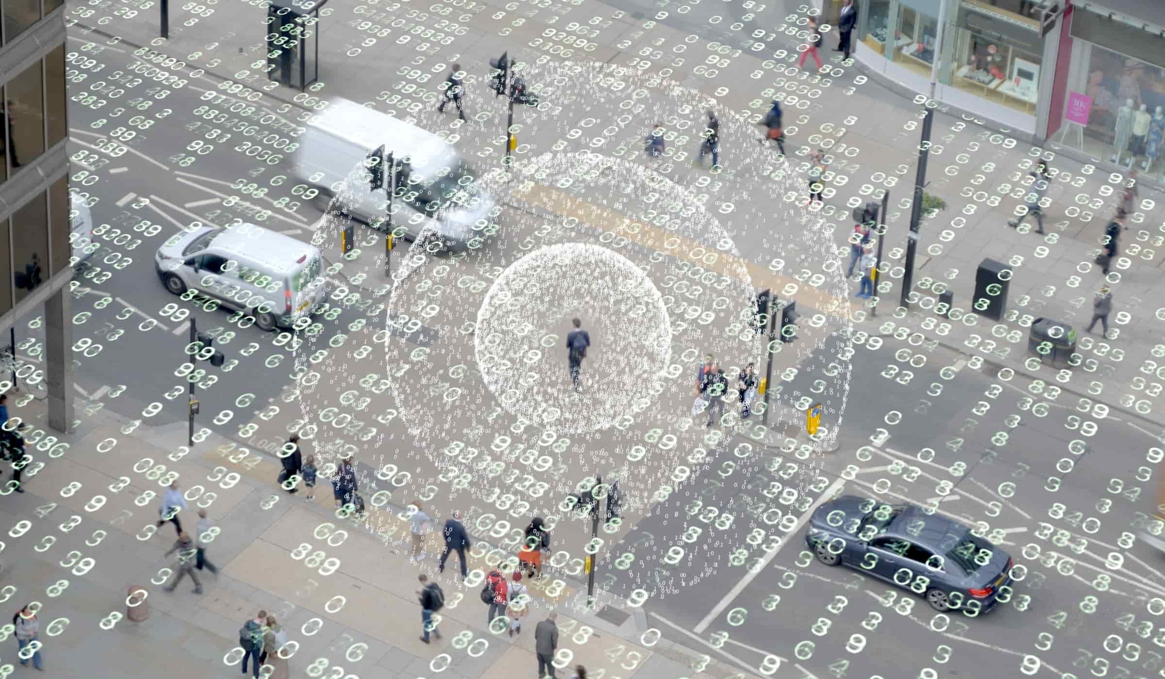 Aerial view of a busy city crossing overlaid with data, representing Octaga investigations and surveillance