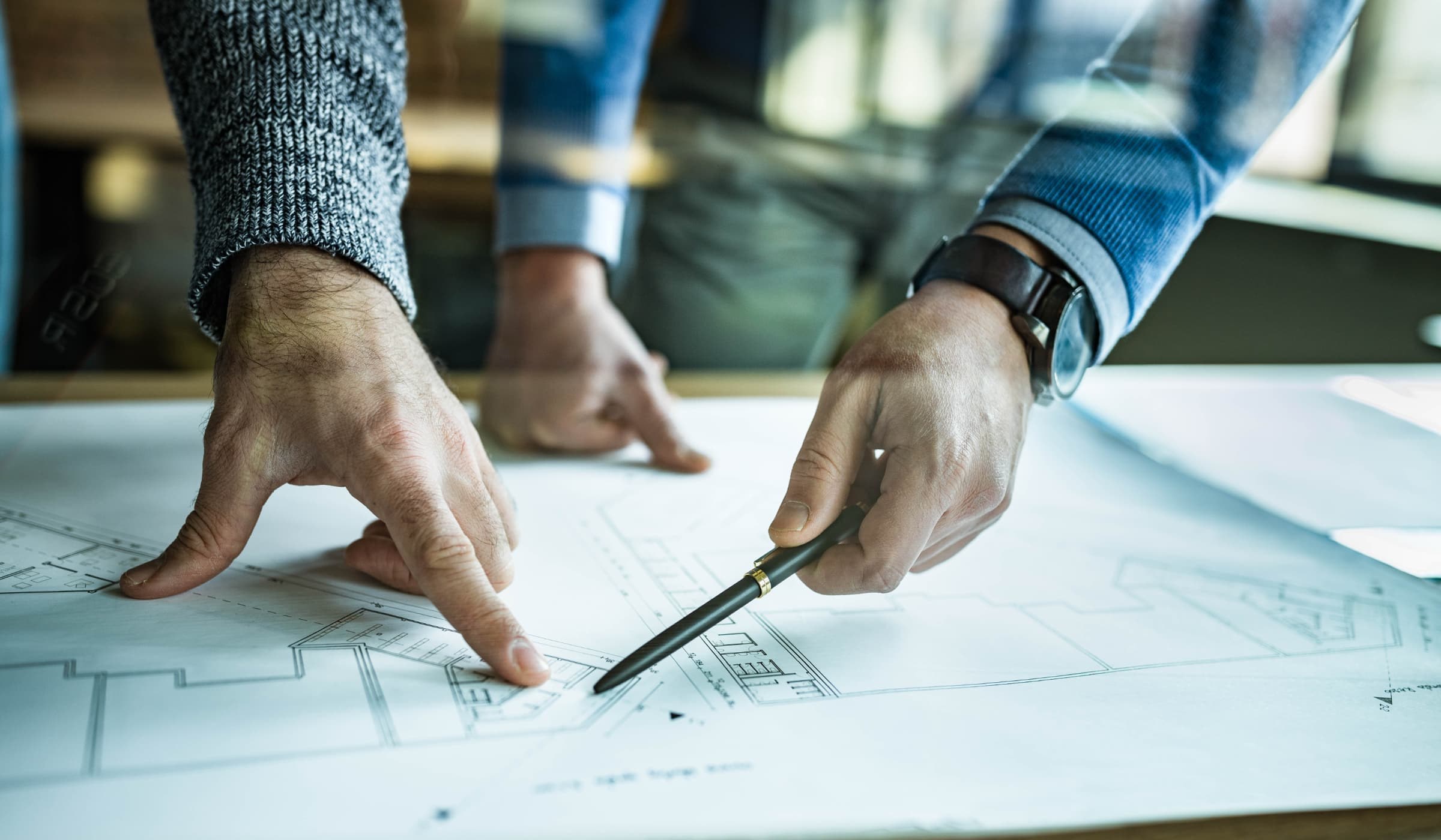 Security consultants reviewing site plans during a security risk assessment